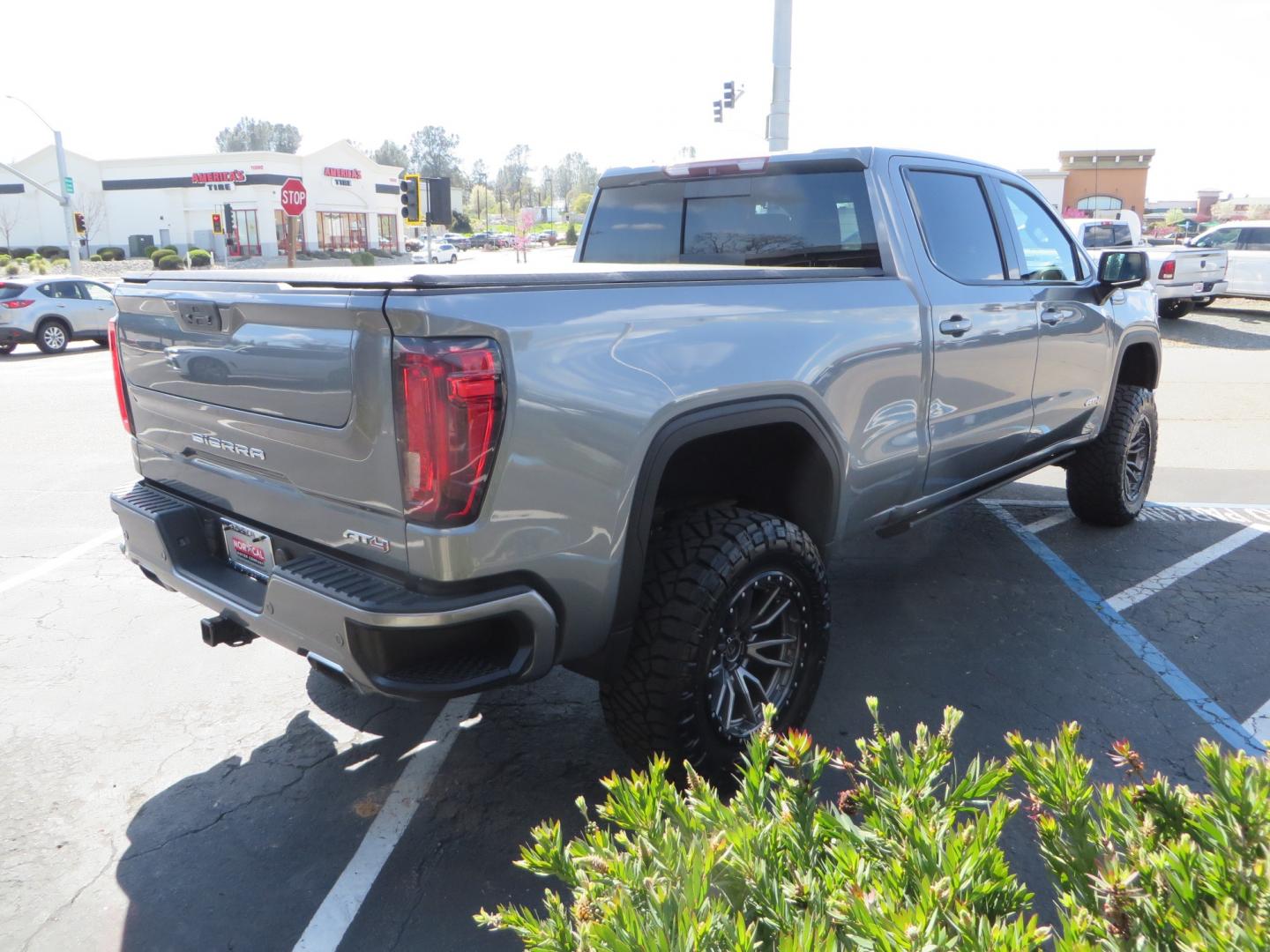 2019 CHARCOAL /BLACK GMC Sierra 1500 AT4 Crew Cab Long Box 4WD (1GTP9EEL6KZ) with an 6.2L V8 OHV 16V engine, 6A transmission, located at 2630 Grass Valley Highway, Auburn, CA, 95603, (530) 508-5100, 38.937893, -121.095482 - Dont miss this AT4 featuring a 4" RC lift kit kit, 35" Nitto Ridge Grappler tires, 20" Fuel Rebel wheels, Amp POwer steps, Air Bags, and a Tyger Bed cover. - Photo#4